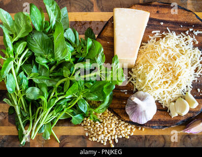 cooking of italian Pesto sauce - various ingredients on wooden board Stock Photo