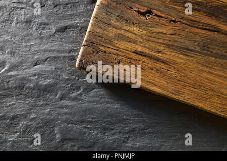 Top view of wooden desk and black table background Stock Photo