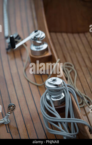 Nautical details on boat deck with ropes and marine tools Stock Photo
