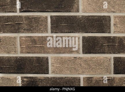 Grainy texture brown bricks wall pattern background Stock Photo