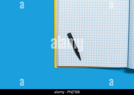 Black used pencil lying on a workbook Stock Photo