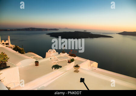 Overlooking from the hotel terrace in famous sunset at Santorini island, Greece, Stock Photo