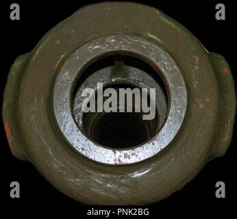 Muzzle brake of the old Soviet tank. Cannon barrel isolated on black background, concept for war or army weapons Stock Photo