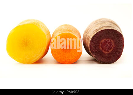 Cross section of some mixed carrots on a white background Stock Photo