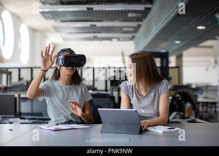 High school students using VR headset in class Stock Photo