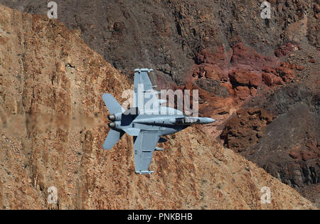 E/A-18G Growler of VX-31 Dust Devils on low level pass through Star Wars Canyon on Jedi transition, Death Valley, California. Stock Photo