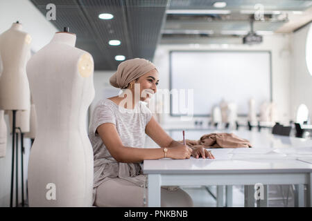 Happy muslim female student fashion designer Stock Photo