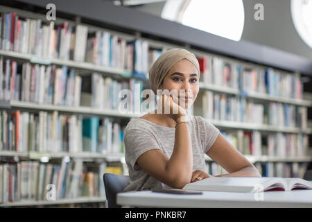 Muslim female student in college library Stock Photo
