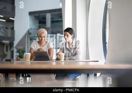 Muslim businesswomen having a meeting in an office Stock Photo
