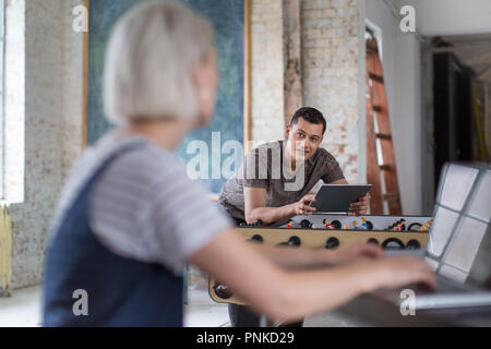 Young adult male using digital tablet in a creative office Stock Photo