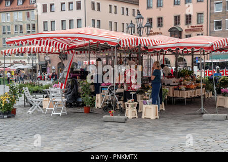 Vendors sell produce and gifts in Nuremberg Market Square Stock Photo