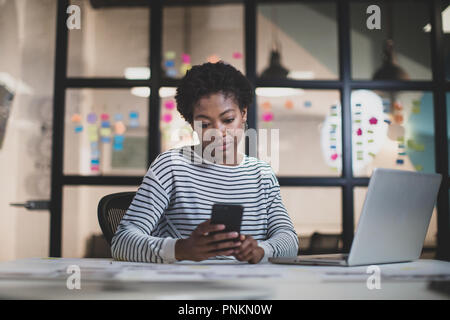 African American female working late in an office Stock Photo