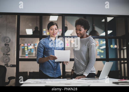Coworkers in a late meeting Stock Photo