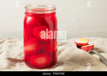 Preserved Pink Pickled Eggs in a Jar Stock Photo