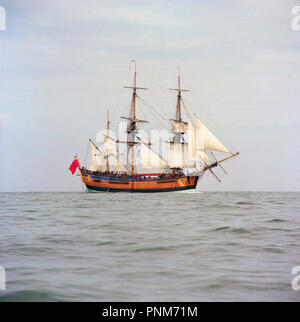 HM Bark Endeavour replica in Fishguard Bay Harbour. Pembrokeshire Wales UK while circumnavigating the world in 1997 Stock Photo