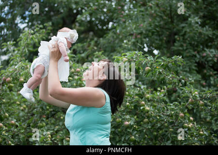 Belarus, Gomel, on July 14, 2018. A holiday in the village of Zyabrovka. Mother throws a newborn baby Stock Photo