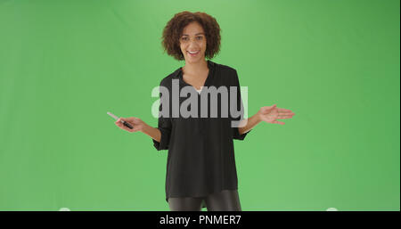 Confident millennial african American teacher giving lesson on green screen Stock Photo