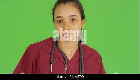 A doctor poses for a portrait on green screen Stock Photo