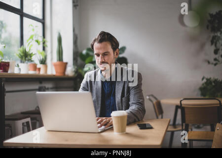 Freelance businessman working in a cafe Stock Photo