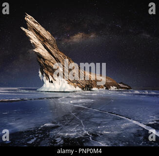 Frozen lake Baikal in winter, with starry sky and milky way Stock Photo