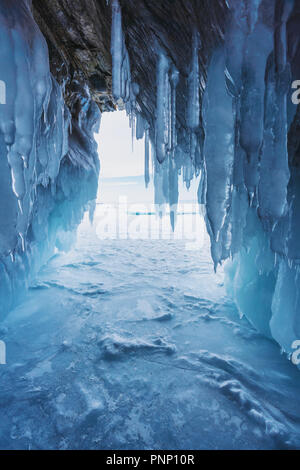 Winter frozen ice cave at frozen lake Baikal in Siberia, Russia Stock Photo