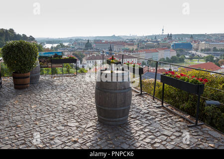 Prague, Czech Republic - August 25, 2018: Picturesque and romantic view over the Prague with a bottle of wine Stock Photo