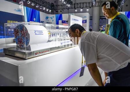 Chengdu, China's Sichuan Province. 20th Sep, 2018. Traders view the railway equipments at the Sichuan booth during the 17th Western China International Fair (WCIF) in Chengdu, southwest China's Sichuan Province, Sept. 20, 2018. Credit: Lyu Mingze/Xinhua/Alamy Live News Stock Photo