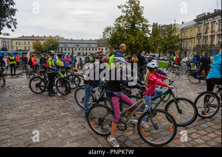 Krakow, Poland. 22nd Sep, 2018. A girl stands on a bicycle as she takes part in the Mass Mass Bicycle Ride as part of the European Day without Car at Podgorze Square. Credit: Omar Marques/SOPA Images/ZUMA Wire/Alamy Live News Stock Photo