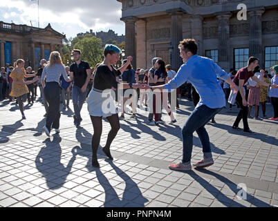 Edinburgh, Scotland, UK, 22 September 2018. Weather, in the autumn sunshine with 14 degrees Mr Freakbubbles entertains children and adults alike with his bubble show at the Mound and Edinburgh Lindy Exchange hold their Annual Swing Dancing Festival where members and audience participate and enjoy the experience. While others chose the less energetic lazing in Princes Street Gardens East. Stock Photo