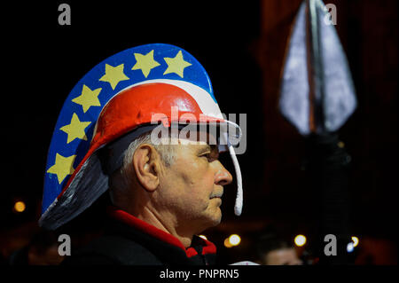 Krakow, Poland. 22nd Sep, 2018. A man seen with a handmade roman helmet with EU flag stars and Polish flag colors and a spear during the protest.Protest called ''We have the right to free courts'' at the main Square.The European Network of Councils for the Judiciary (ENCJ) has suspended the Polish council membership because it's no longer being independent because it is now appointed by politicians, rather than judges as before. The European Commission decided this week to take Poland to the top European Union court over the controversial court reforms. (Credit Image: © Omar Marques/ Stock Photo