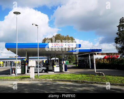 Llanelli, UK: September, 2018: Customers refuel their cars at a Tesco Petrol Station. Tesco is a British multinational groceries and general retailer. Stock Photo