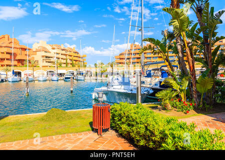 Sailing Boats in beautiful Sotogrande marina with colorful apartments and palm trees on shore, Costa del Sol, Spain Stock Photo