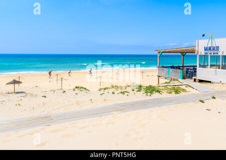 TARIFA BEACH, SPAIN - MAY 8, 2018: Restaurant terrace on sandy beach on Costa de la Luz coast..Spain is second most visited by tourists country in Eur Stock Photo