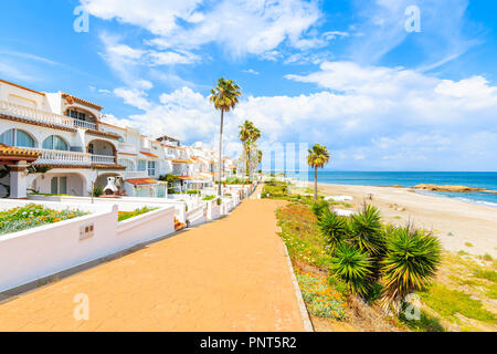Path along beautiful beach in small coastal village near Marbella on Costa de Sol, Spain Stock Photo
