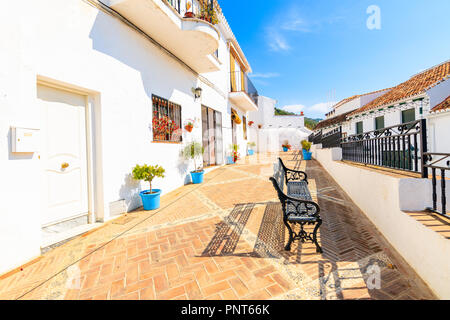 MIJAS TOWN, SPAIN - MAY 9, 2018: Street with white houses in picturesque village of Mijas, Andalusia. Spain is second most visited by tourists country Stock Photo