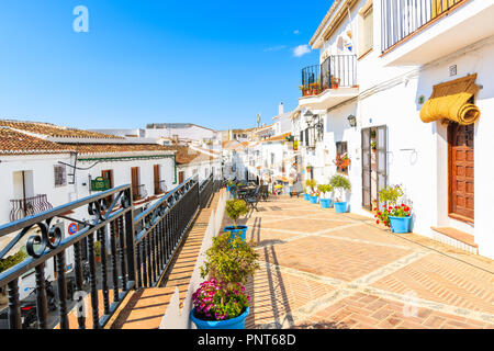 MIJAS TOWN, SPAIN - MAY 9, 2018: Street with restaurants and bars in picturesque village of Mijas, Andalusia. Spain is second most visited by tourists Stock Photo