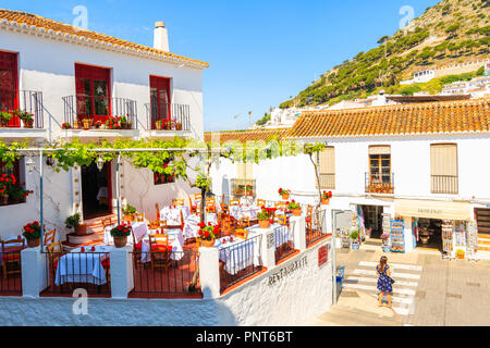 MIJAS VILLAGE, SPAIN - MAY 9, 2018: Restaurant terrace in picturesque white village of Mijas, Andalusia. Southern Spain is famous for mountain village Stock Photo