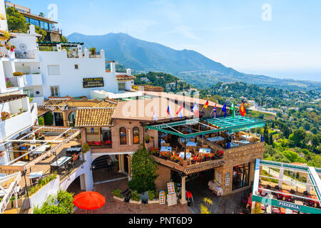 MIJAS VILLAGE, SPAIN - MAY 9, 2018: Restaurant terrace in picturesque white village of Mijas, Andalusia. Southern Spain is famous for mountain village Stock Photo