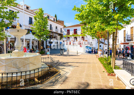 MIJAS VILLAGE, SPAIN - MAY 9, 2018: Water fountain on square in picturesque white village of Mijas, Andalusia. Southern Spain is famous for mountain v Stock Photo