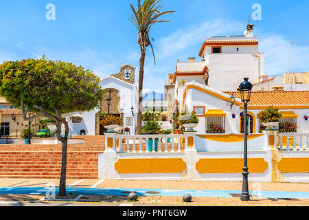 Typical white church building and houses in Estepona town, Costa del Sol, Spain Stock Photo