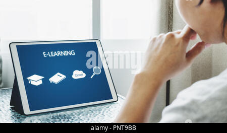 Online education, e-learning and e-book concept. a man using digital tablet for education Stock Photo