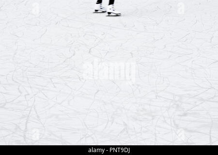 Ice skating background with skaters legs in motion blur Stock Photo