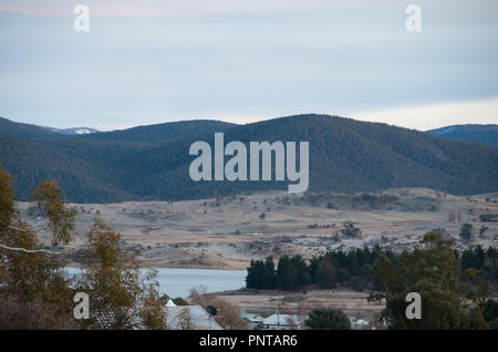 Overlooking lake jindabyne and the snowy mountains on a still morning Stock Photo