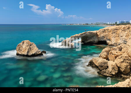 Long exposure shot of Love Bridge - picturesque natural formation creating a white-rock arch in Ayia Napa, Cyprus Stock Photo