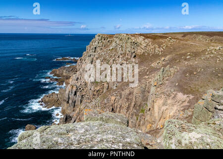 Higher Bosistow Headland & Longships Lighthouse; View with Granite Rock Formations and Atlantic Ocean. Carn Les Boel, near Lands End, Cornwall, Englan Stock Photo