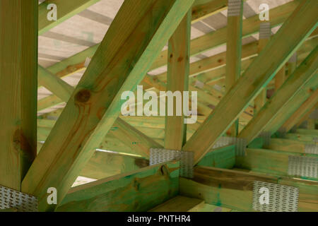 New residential construction home framing against a sunny sky.Local focus Stock Photo