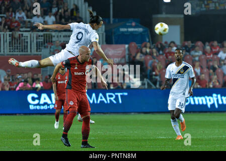 Zlatan Ibrahimovic jumping  for the ball  during 2018 MLS Regular Season match between Toronto FC (Canada) and  LA Galaxy (USA) at BMO Field (Score 5: Stock Photo