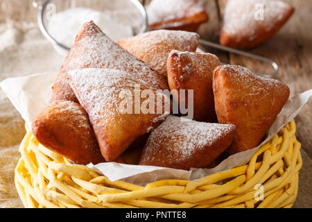 Mandazi is a slightly sweet East African Street Food; spicy, airy yeast doughnut dough made with coconut milk, flavored with cardamom and grated fresh Stock Photo