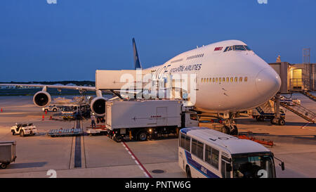 Loading of a jumbo jet at Narita Airport, Japan,  at dusk Stock Photo
