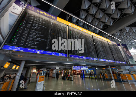 Large flight information board at Frankfurt am Main Airport, Germany Stock Photo